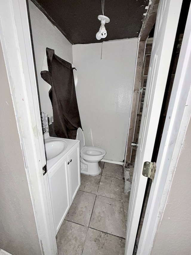 bathroom with toilet and vanity