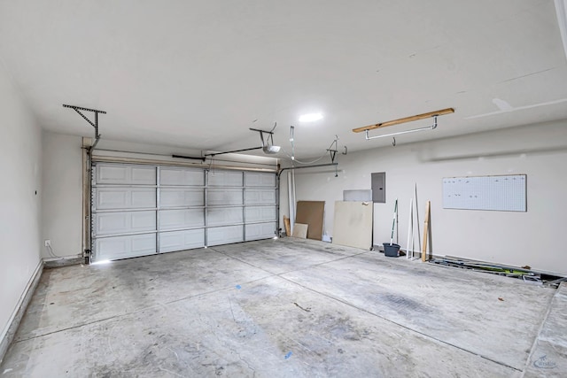 garage with electric panel and a garage door opener