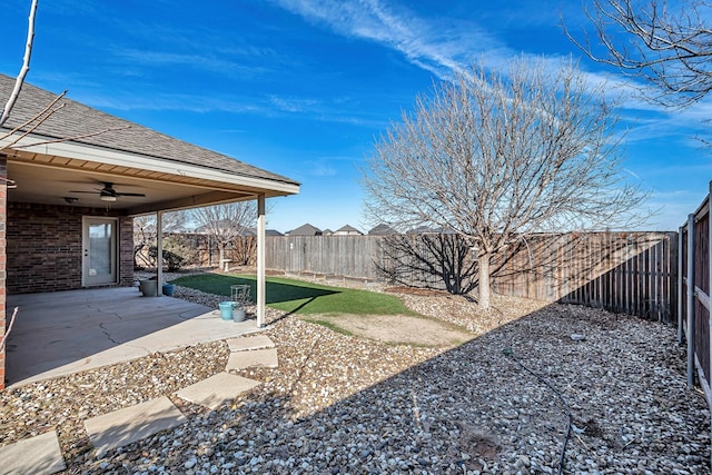 view of yard featuring ceiling fan and a patio area