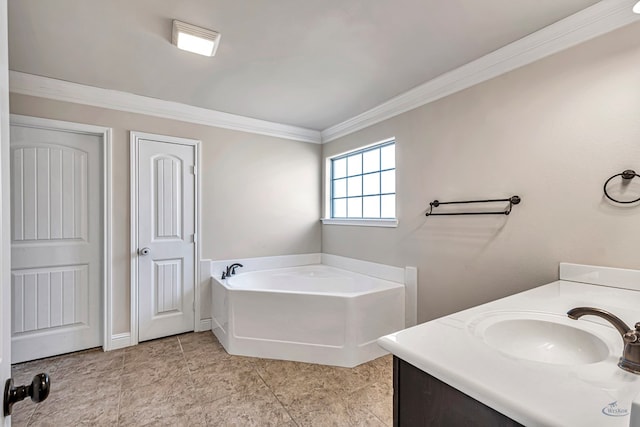 bathroom with vanity, a bathtub, and ornamental molding