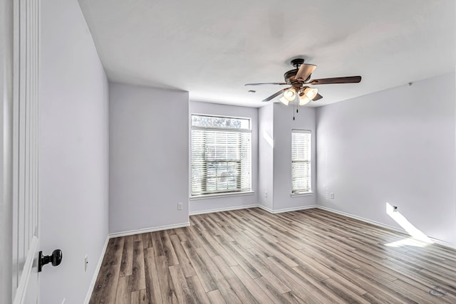 unfurnished room featuring ceiling fan and light wood-type flooring