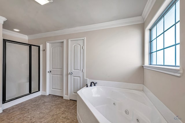 bathroom featuring ornamental molding and separate shower and tub