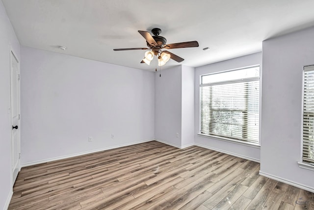 unfurnished room with ceiling fan and light hardwood / wood-style floors