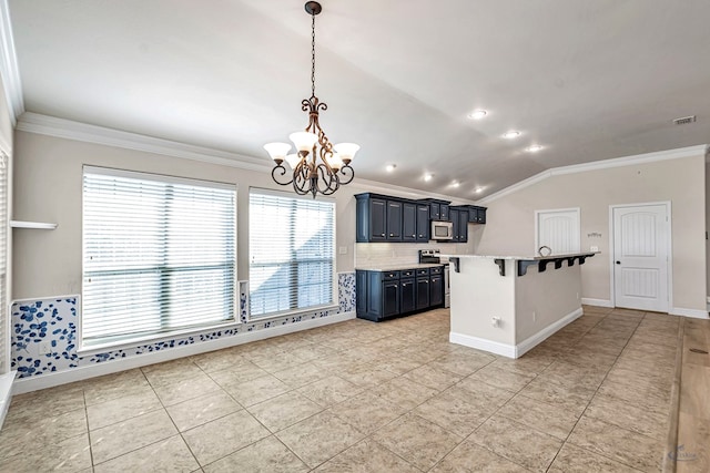 kitchen with a breakfast bar area, appliances with stainless steel finishes, tasteful backsplash, vaulted ceiling, and pendant lighting