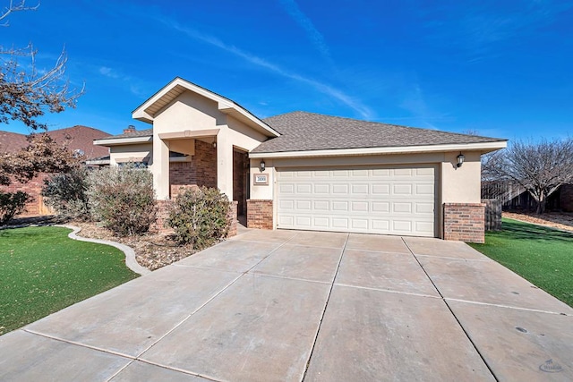 view of front facade with a front yard and a garage