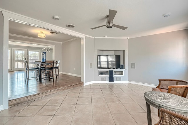 710 W Nobles Ave, Midland, TX 79701 - living area with crown molding, a ceiling fan, light tile patterned flooring, and baseboards