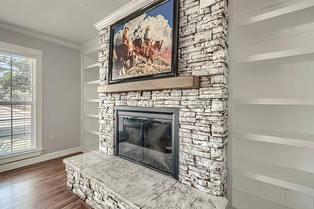 710 W Nobles Ave, Midland, TX 79701 - detailed view of ornamental molding, wood finished floors, baseboards, a stone fireplace, and built in shelves