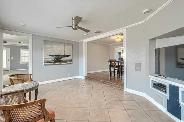 710 W Nobles Ave, Midland, TX 79701 - living area featuring a ceiling fan, ornamental molding, light tile patterned flooring, and baseboards