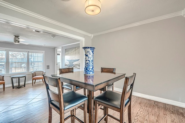 710 W Nobles Ave, Midland, TX 79701 - dining area with ornamental molding, light wood-type flooring, baseboards, and ceiling fan