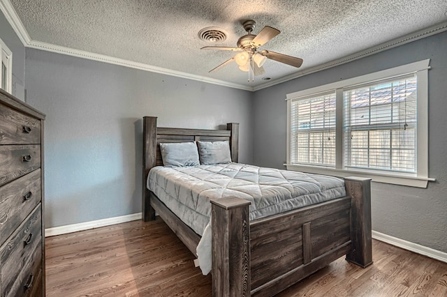 710 W Nobles Ave, Midland, TX 79701 - bedroom with crown molding, a textured ceiling, wood finished floors, baseboards, and a ceiling fan