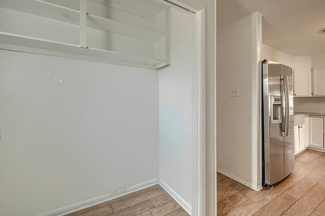 710 W Nobles Ave, Midland, TX 79701 - corridor featuring light wood-style floors and baseboards