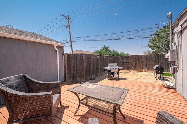 710 W Nobles Ave, Midland, TX 79701 - wooden deck with a fenced backyard and a grill