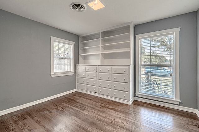 710 W Nobles Ave, Midland, TX 79701 - empty room featuring wood finished floors and baseboards
