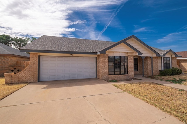 ranch-style home featuring driveway, brick siding, an attached garage, and a shingled roof