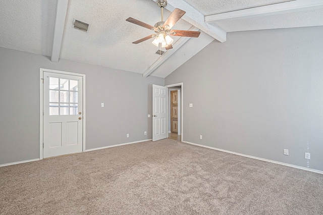 empty room featuring light carpet, visible vents, a textured ceiling, and lofted ceiling with beams