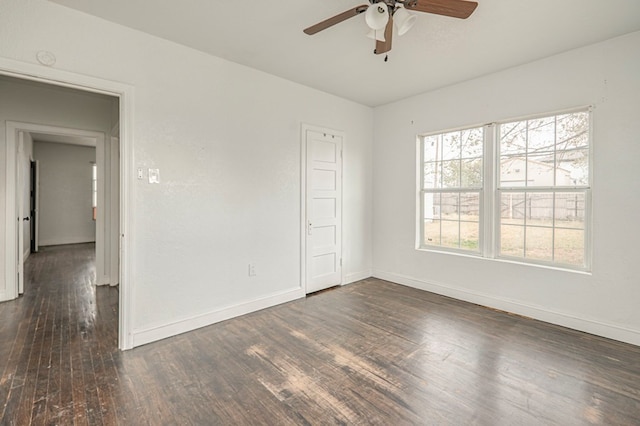 unfurnished bedroom with dark wood-style floors, ceiling fan, and baseboards