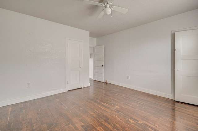 unfurnished bedroom with ceiling fan, baseboards, and wood finished floors