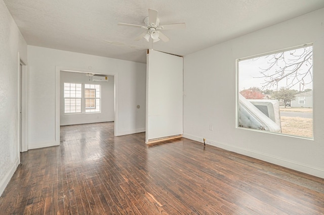 unfurnished room with baseboards, a textured ceiling, a ceiling fan, and hardwood / wood-style floors