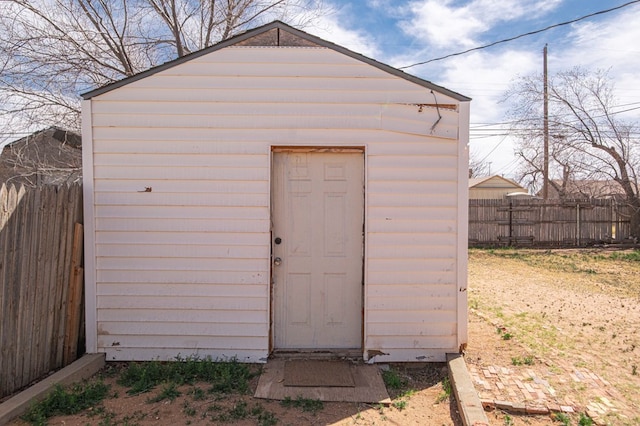 view of shed with a fenced backyard