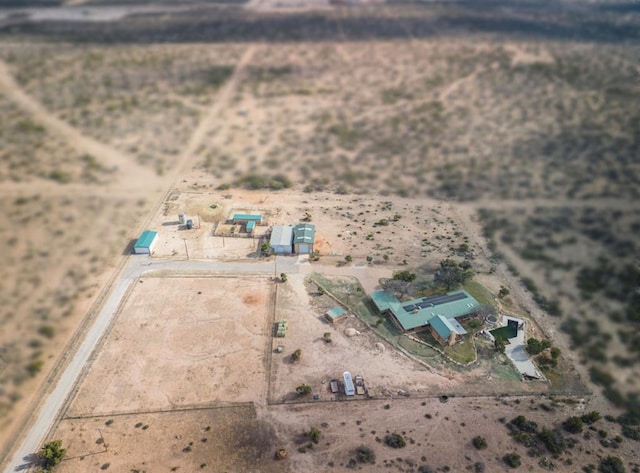 birds eye view of property featuring a desert view