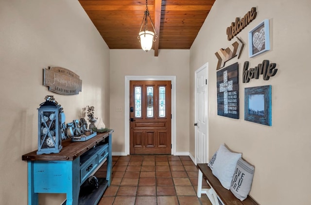 entryway featuring tile patterned floors, wooden ceiling, and baseboards