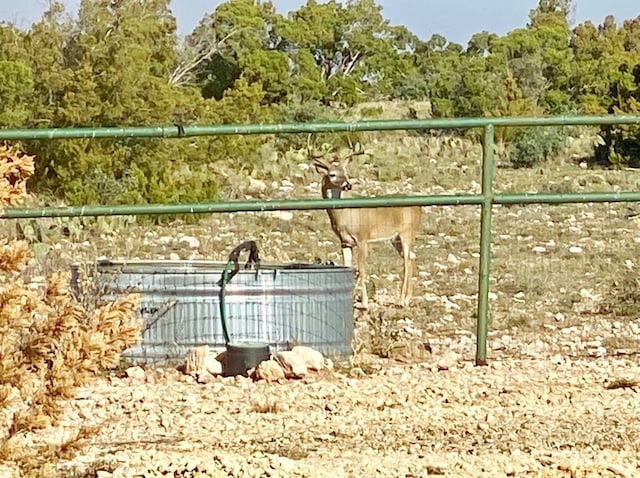 view of community with fence