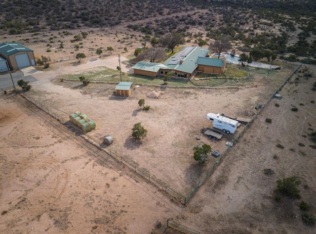 bird's eye view with a desert view and a rural view