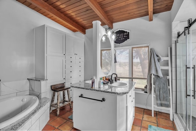 interior space with white cabinetry, wooden ceiling, light stone counters, and a sink