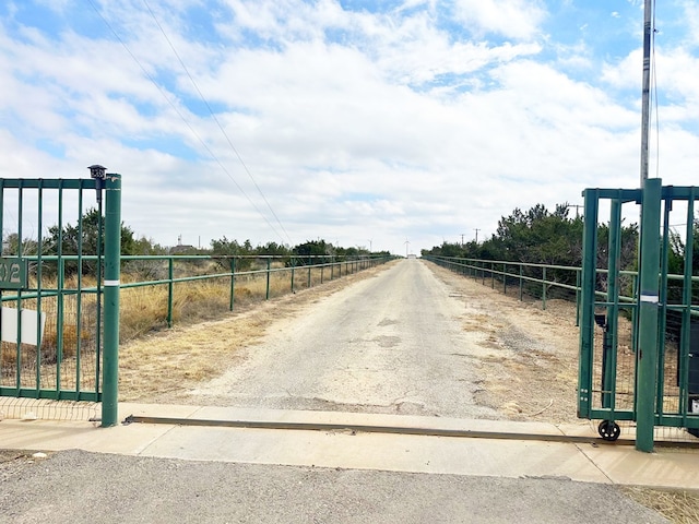 view of road featuring a gate