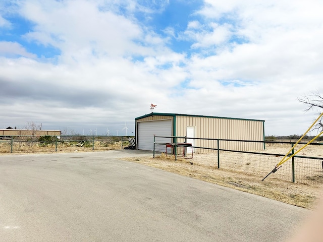 view of outbuilding with an outbuilding and fence