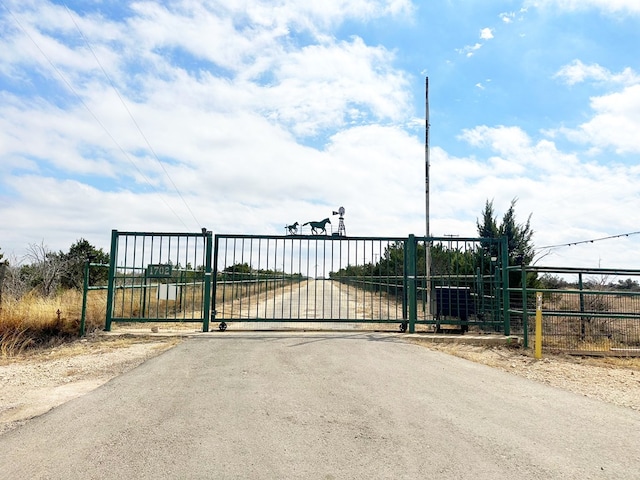 view of gate featuring fence