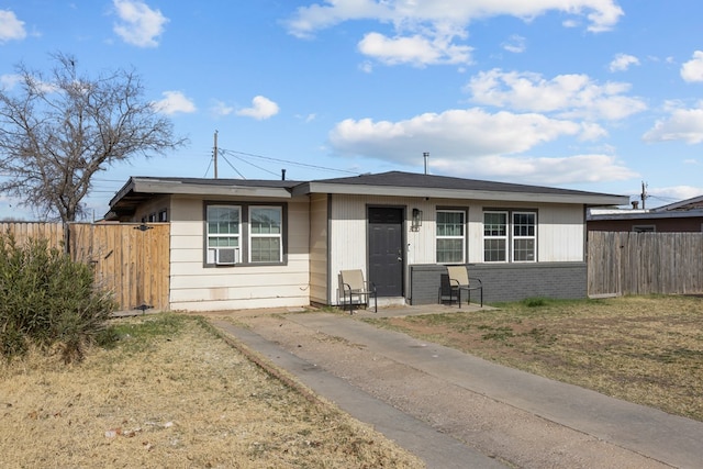 ranch-style house with cooling unit