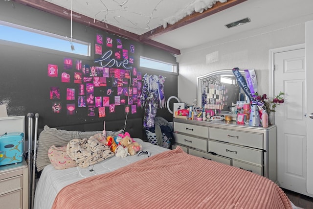 bedroom featuring beam ceiling