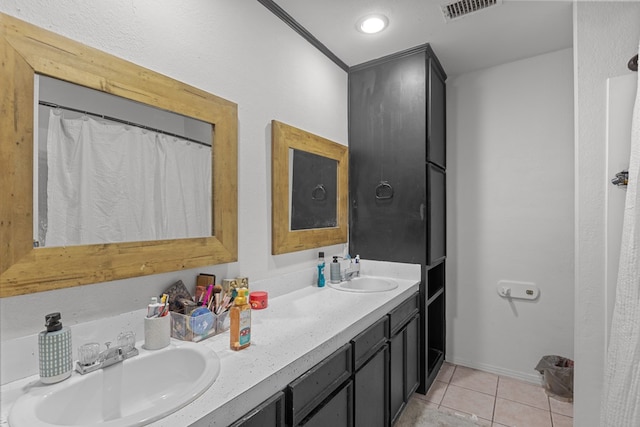 bathroom with tile patterned flooring and vanity