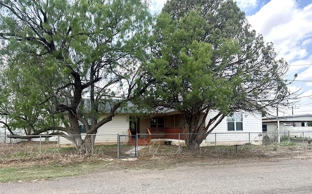 305 S 14th St, Alpine, TX 79830 - view of property hidden behind natural elements with a fenced front yard