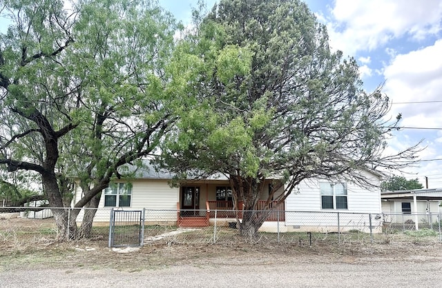 305 S 14th St, Alpine, TX 79830 - view of front of house with crawl space, a fenced front yard, and a porch