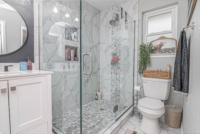 full bath with marble finish floor, toilet, a textured wall, vanity, and a marble finish shower