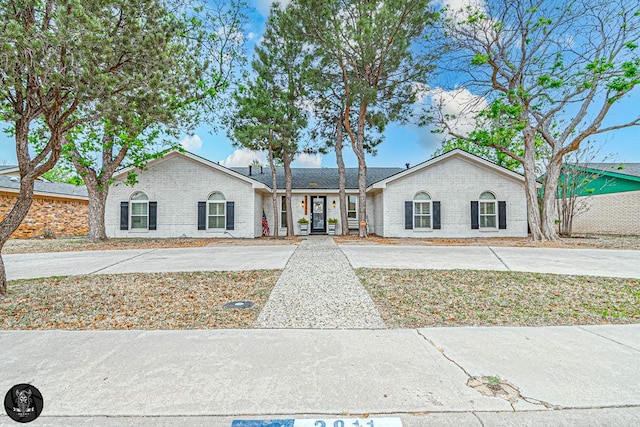 single story home with brick siding