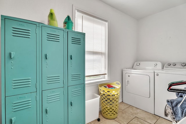 2004 N Monticello St, Big Spring, TX 79720 - laundry room with washer and clothes dryer and light tile patterned floors