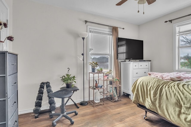 2004 N Monticello St, Big Spring, TX 79720 - bedroom featuring wood finished floors and a ceiling fan