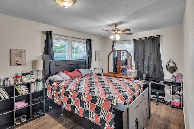 2004 N Monticello St, Big Spring, TX 79720 - bedroom featuring wood finished floors, multiple windows, and a ceiling fan