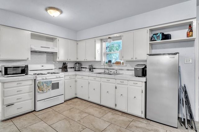 2004 N Monticello St, Big Spring, TX 79720 - kitchen featuring stainless steel appliances, open shelves, under cabinet range hood, and white cabinetry