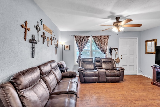 2004 N Monticello St, Big Spring, TX 79720 - living area featuring a ceiling fan and wood finished floors