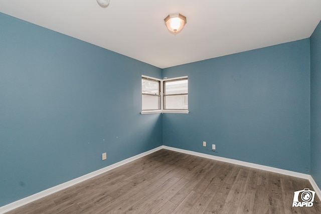 unfurnished room featuring wood-type flooring