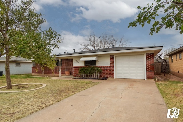 single story home featuring a front yard and a garage