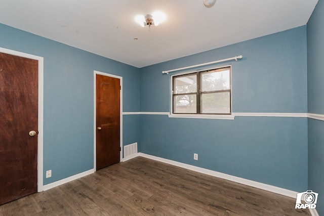 empty room featuring dark hardwood / wood-style floors