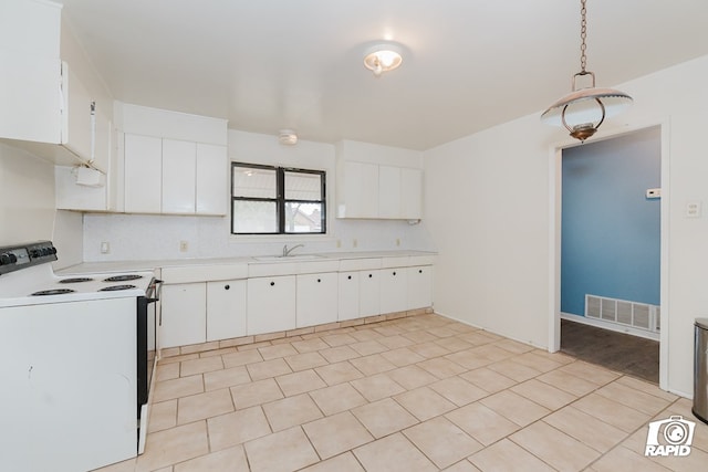 kitchen with electric range, decorative light fixtures, white cabinetry, and sink