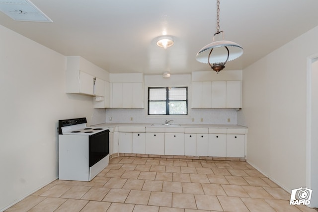 kitchen featuring tasteful backsplash, white cabinetry, hanging light fixtures, and white electric stove