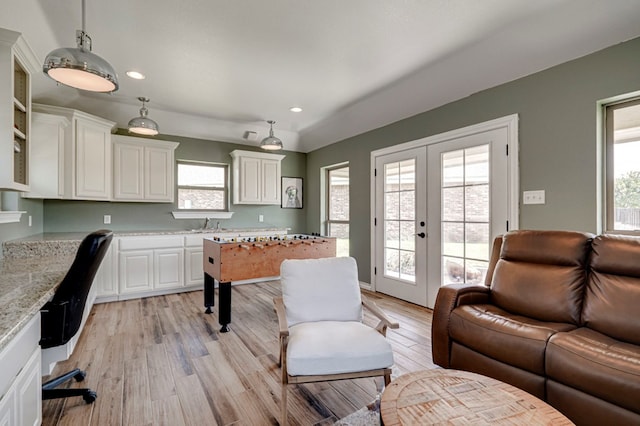801 Keystone Ct, Midland, TX 79705 - home office with french doors, plenty of natural light, recessed lighting, light wood-style flooring, and a sink