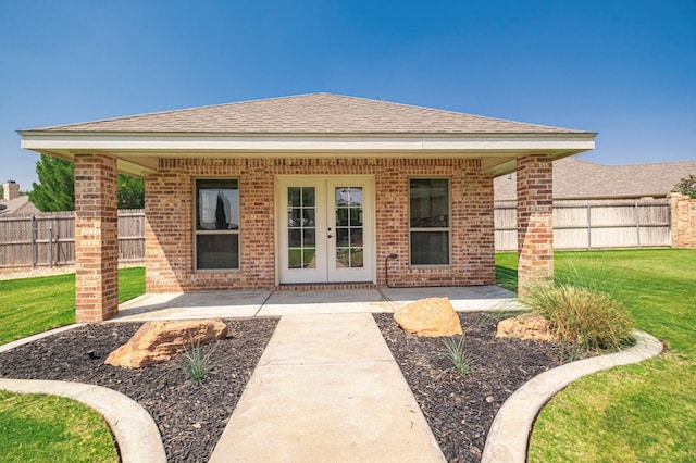 801 Keystone Ct, Midland, TX 79705 - rear view of property with french doors, brick siding, roof with shingles, and a patio area
